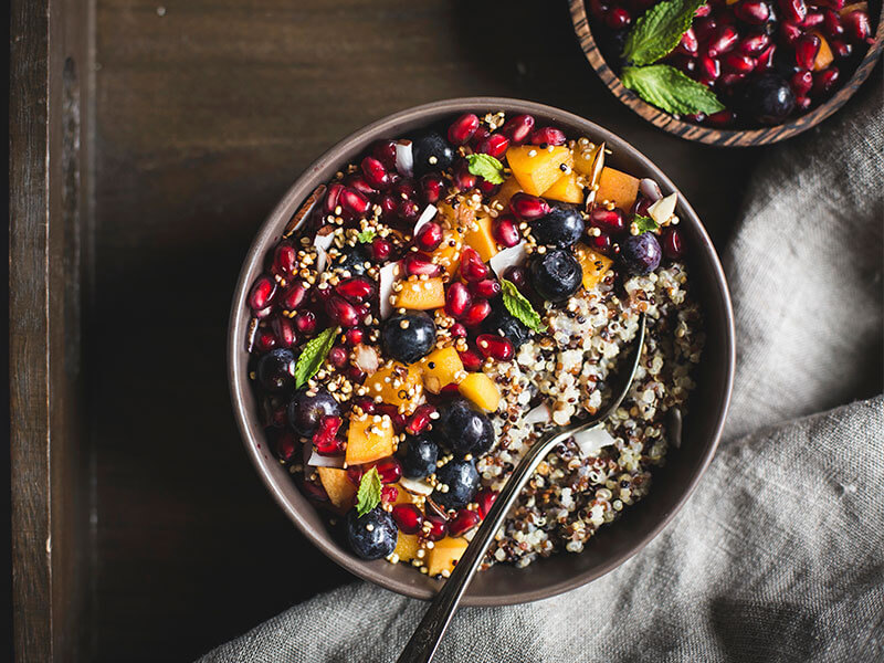 Coconut quinoa porridge with pomegranate and apricots recipe